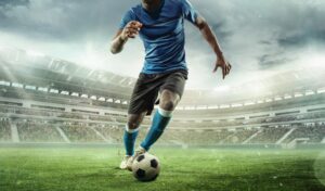 Cropped,Image,Of,Running,Soccer,,Football,Player,At,Stadium,During